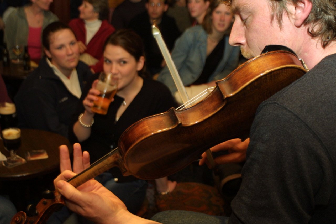 man playing fiddle 